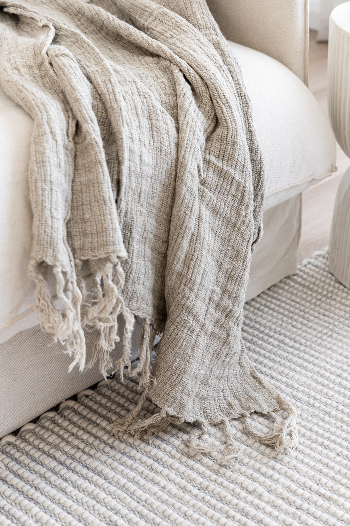 Hand loomed & richly textured the Mesh Rustic Linen throw is both a pure & natural staple piece designed to compliment any interior. Made from 100% linen in a light waffle style finish with fringed sides, it is soft & visually rustic with a quality luxe edge. This beautiful throw creates a luxurious high end quality & aesthetic to your home.   