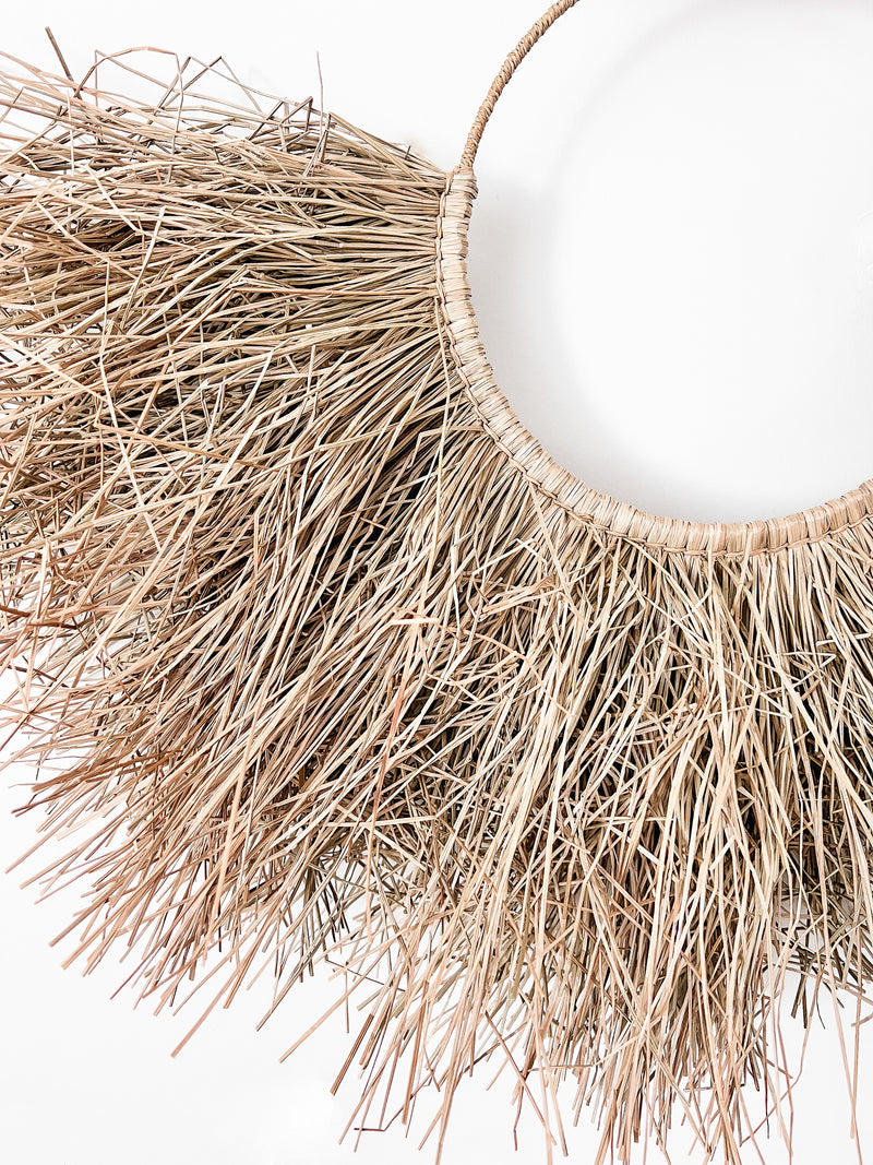 If you love extreme imperfect texture, the Eden Seagrass hanging is your vibe. A jute wrapped hoop with a skirt of uneven alang alang seagrass, created with raw textures & natural elements. This rough, raw & eye catching wall hanging will be you’re new favourite piece. Best suited to natural inspired spaces & for those that prefer a less structured style.