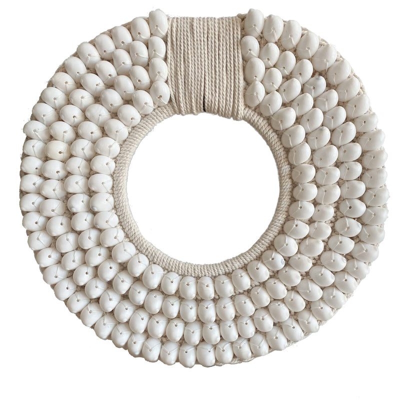 Embellished with crisp white moon shells, intricately sewn onto a thick crochet backing, Our Koko designs are a gorgeous versatile feature made to suit any modern space & inject a coastal vibe.  White Coastal Decor, Papua Shell Tribal Necklace, standing decor, coastal white modern decor. Homewares Melbourne. Sale Now On