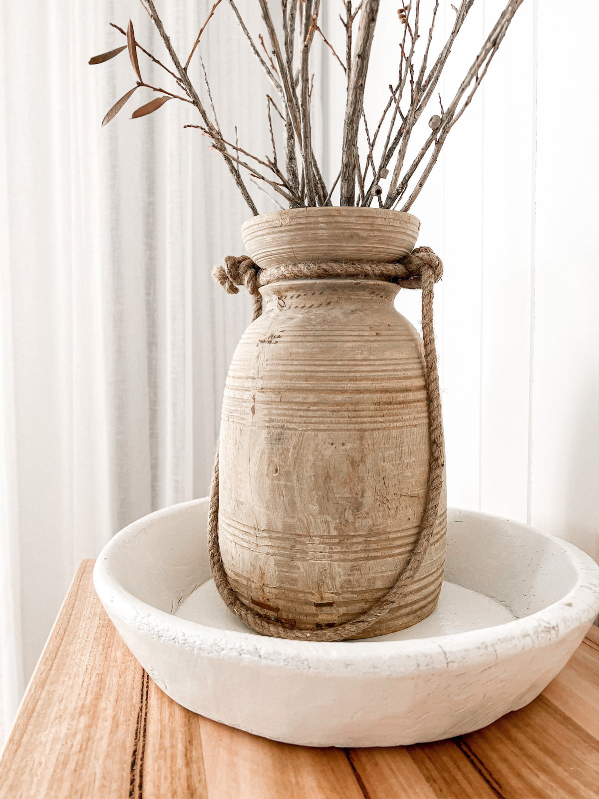 These authentic pots are unique antique pieces dating back approximately 50 years. Each one complete with a beautiful raw earthy aesthetic, a bleached finish & a thick braided Jute handle. Display these treasures empty or fill with your favourite dried florals. Each with a history & story of its own, these one of a kind pieces come with perfect imperfections adding to their rustic appearance. Rustic indian wooden decor. vintage antique farmhouse homewares australia, sale now on 