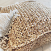 Beautifully handcrafted with natural raffia, the Ohana range pairs well with any style to create a raw coastal aesthetic. Place these floor cushions near a coffee table as a relaxed seating option or footrest to make your indoor or outdoor space feel casual and cosy with a tropical, resort style vibe.  Dimensions: 70cm x 70cm x 20cm high  COVER ONLY. Fill with blankets, cushions, spare quilts, cushions, jumpers or bean fill. Each cushion has a sturdy zipper underneath for easy insertion.  