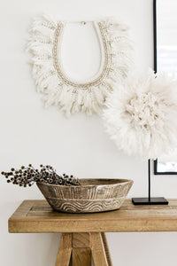 Inspired by a traditional tribal necklace but with the soft bohemian touch of macrame, the Myah hanging is a stunning piece full of neutral feminine texture. Consisting of twelve hand woven feathered macrame leaves in their natural relaxed state & cowrie shell detail